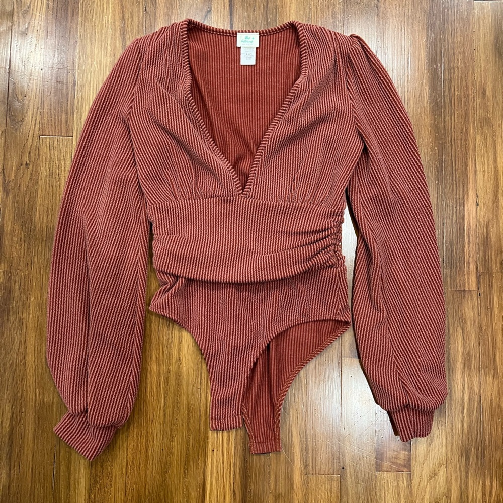NEVER WORN rust colored deep v-neck sweater bodysuit